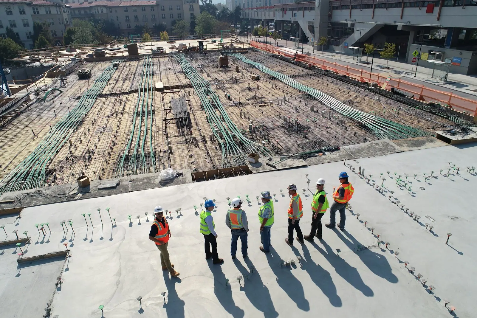 Site team reviewing groundworks on a large new-build site